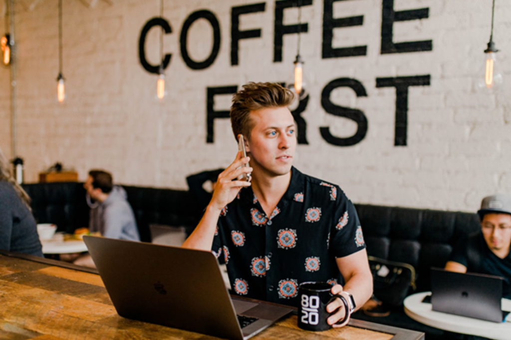 customer and coffee shop on cell phone