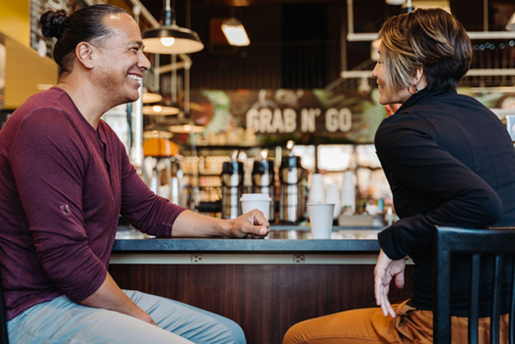 customers chatting on coffee shop bar