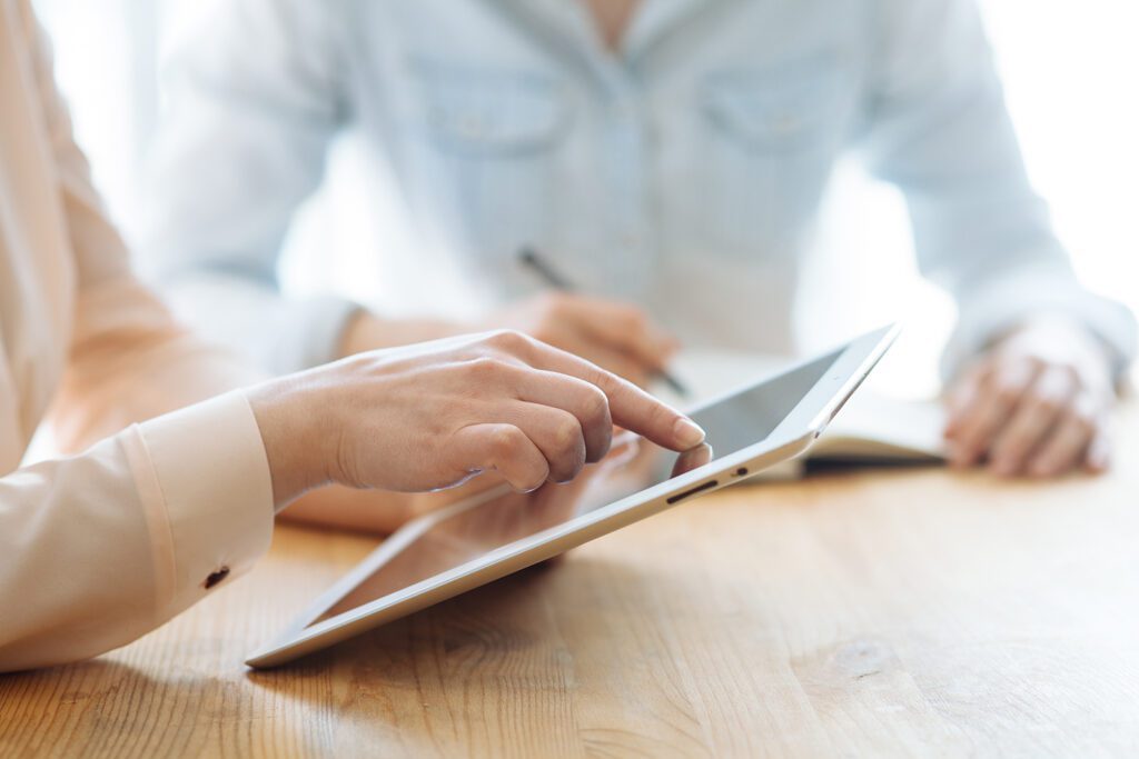 a close-up of a person using a tablet